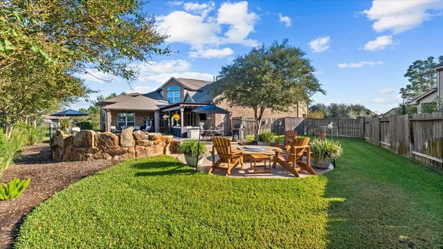 a view of a house with a yard porch and sitting area