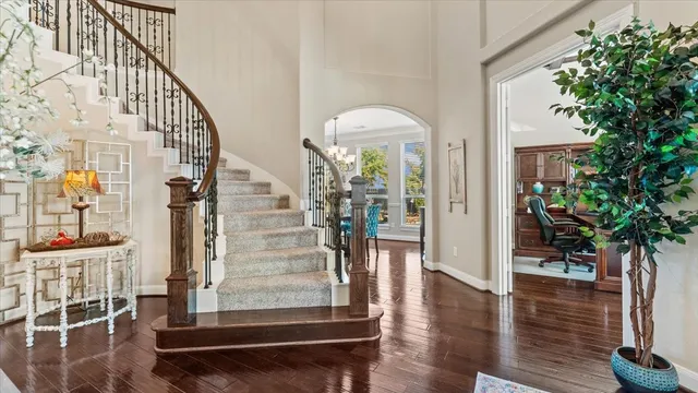a view of entryway and hall with wooden floor