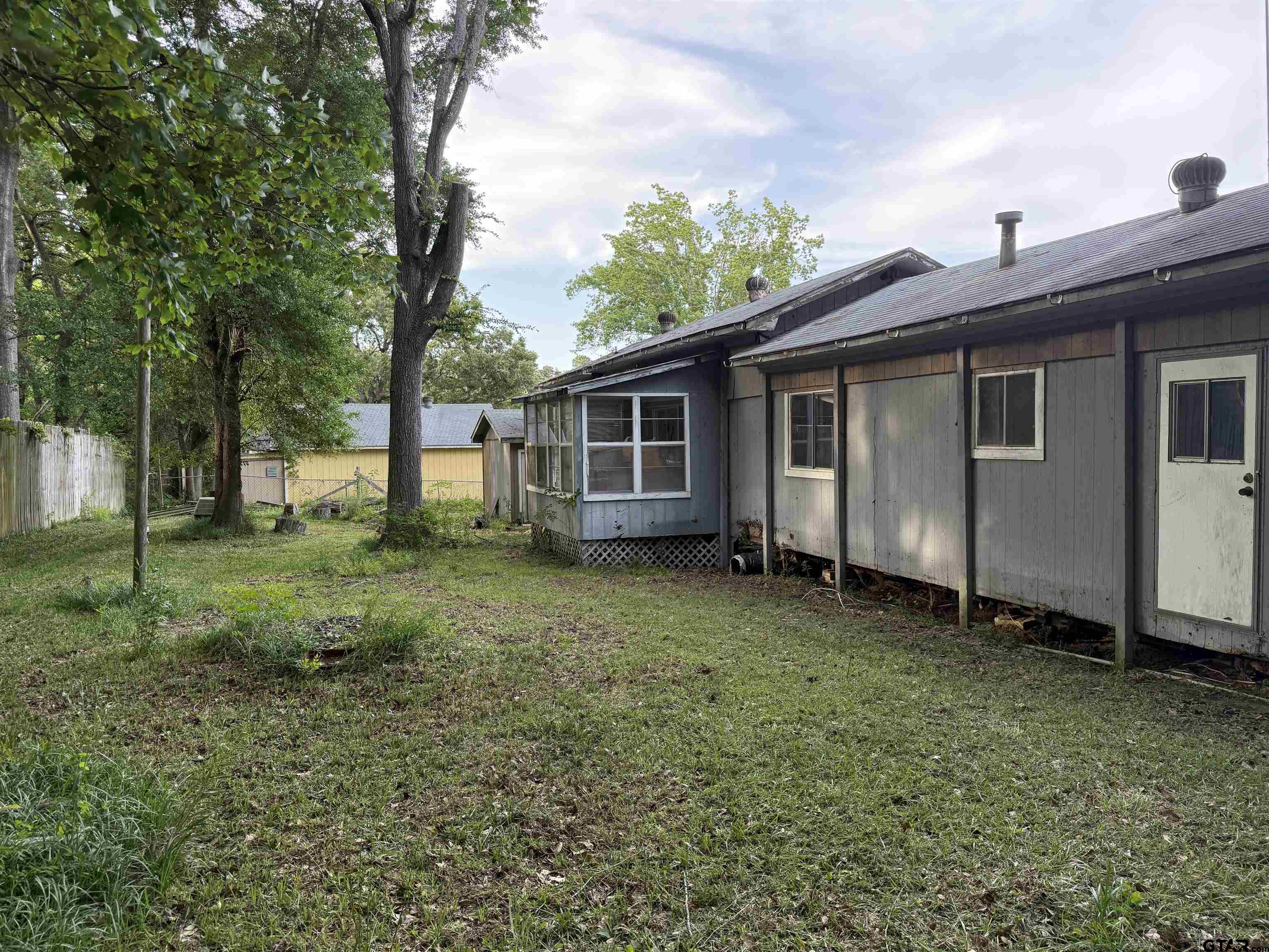 4604 Skyline Drive Chandler, TX 75758 - Photo 15 of 17 a view of a house with a backyard