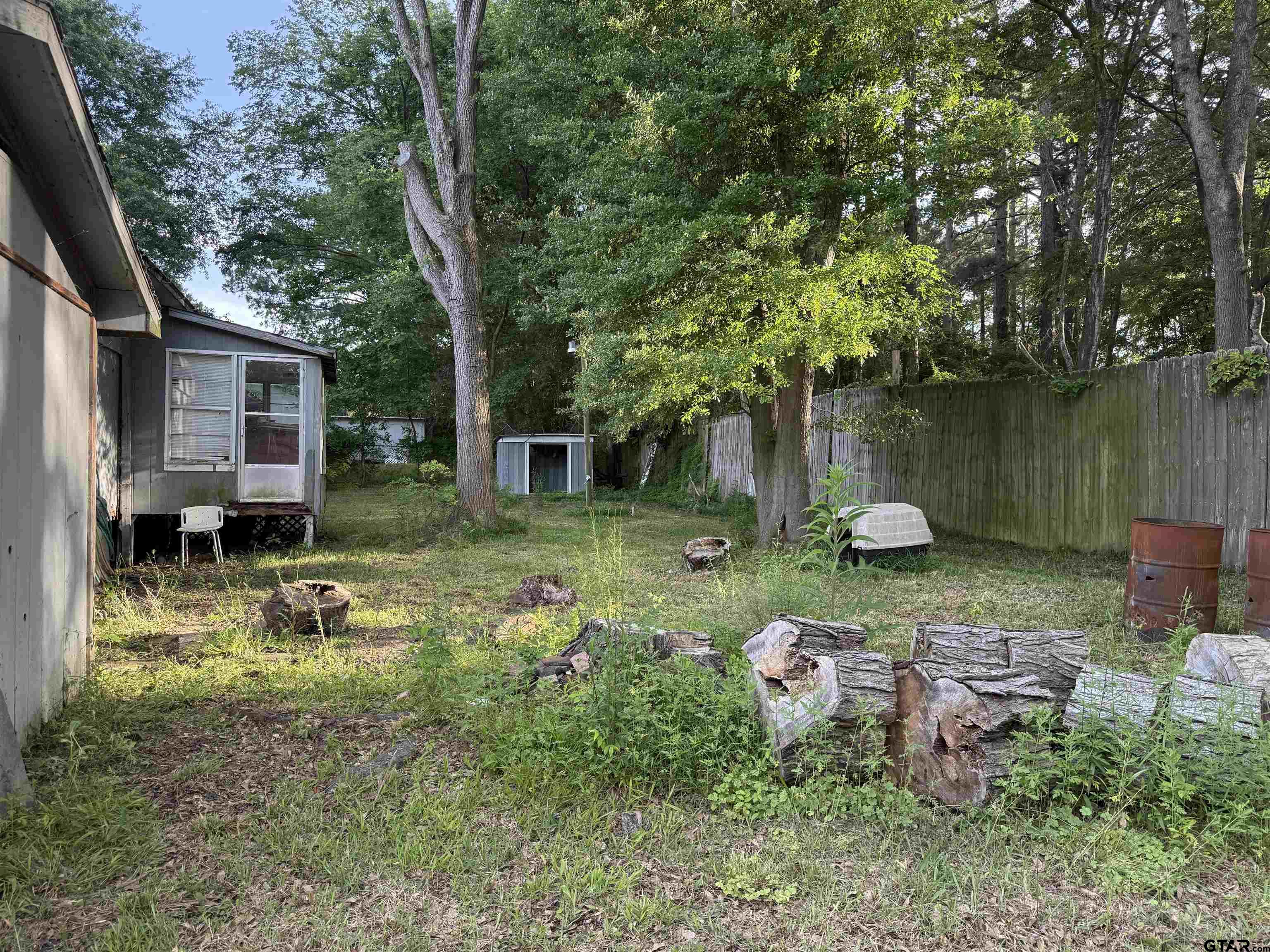 4604 Skyline Drive Chandler, TX 75758 - Photo 16 of 17 a backyard of a house with seating space