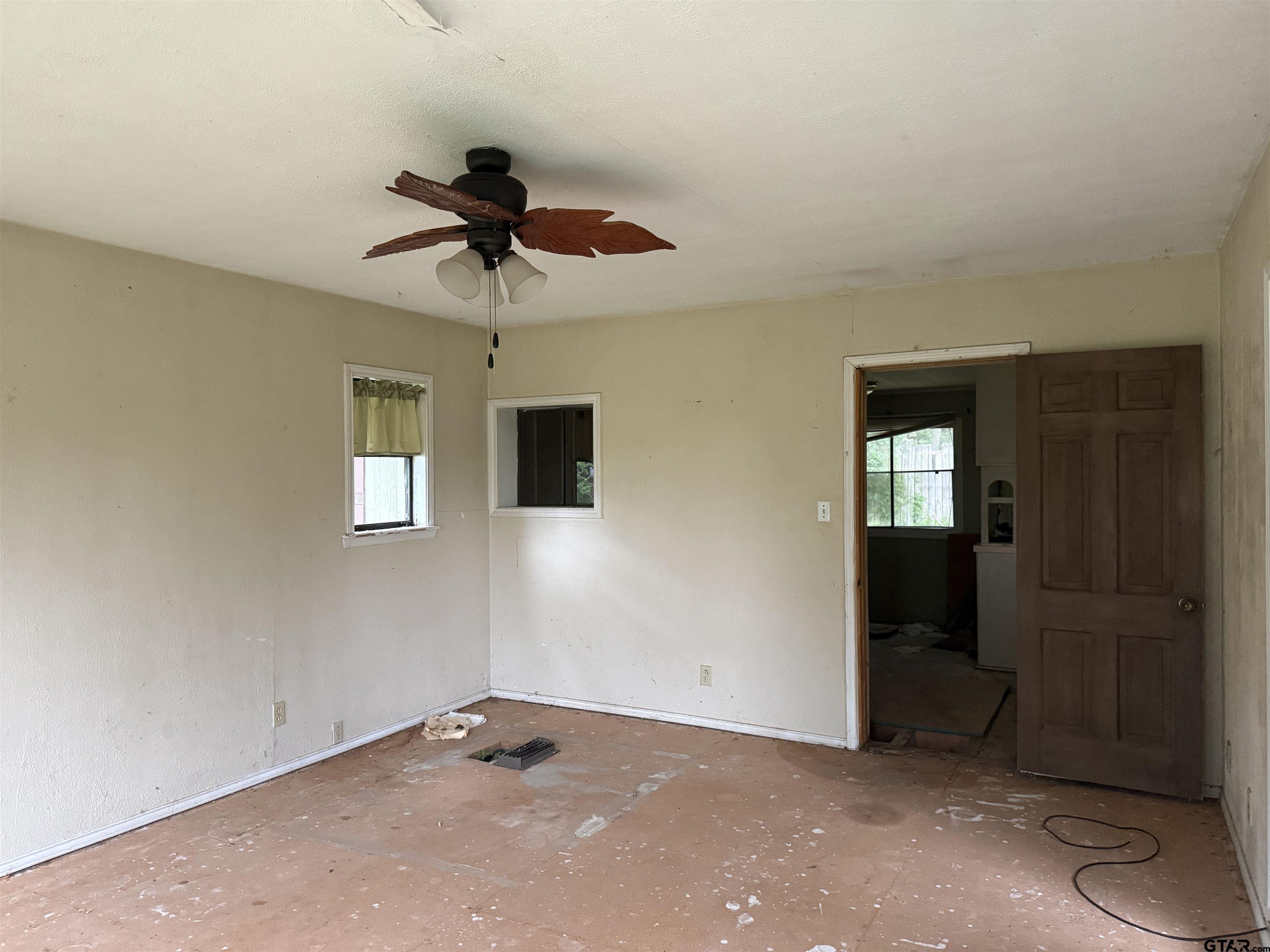 4604 Skyline Drive Chandler, TX 75758 - Photo 7 of 17 a view of a livingroom with a chandelier fan