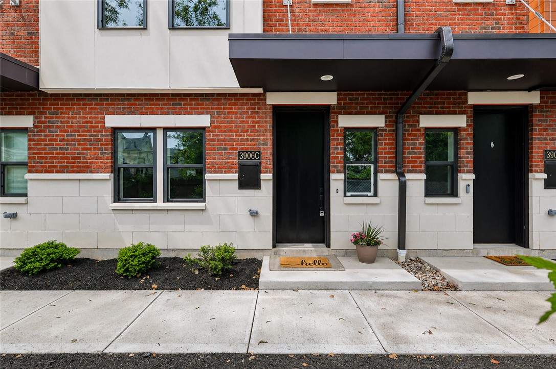 3906 Edwards Road, Unit C Cincinnati, OH 45209 - Photo 45 of 46 This modern townhome facade features brick and siding, offering inviting curb appeal.