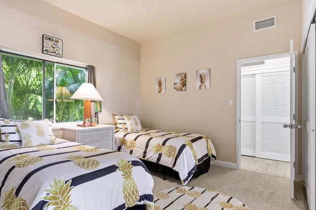 a bedroom with a bed and a lamp