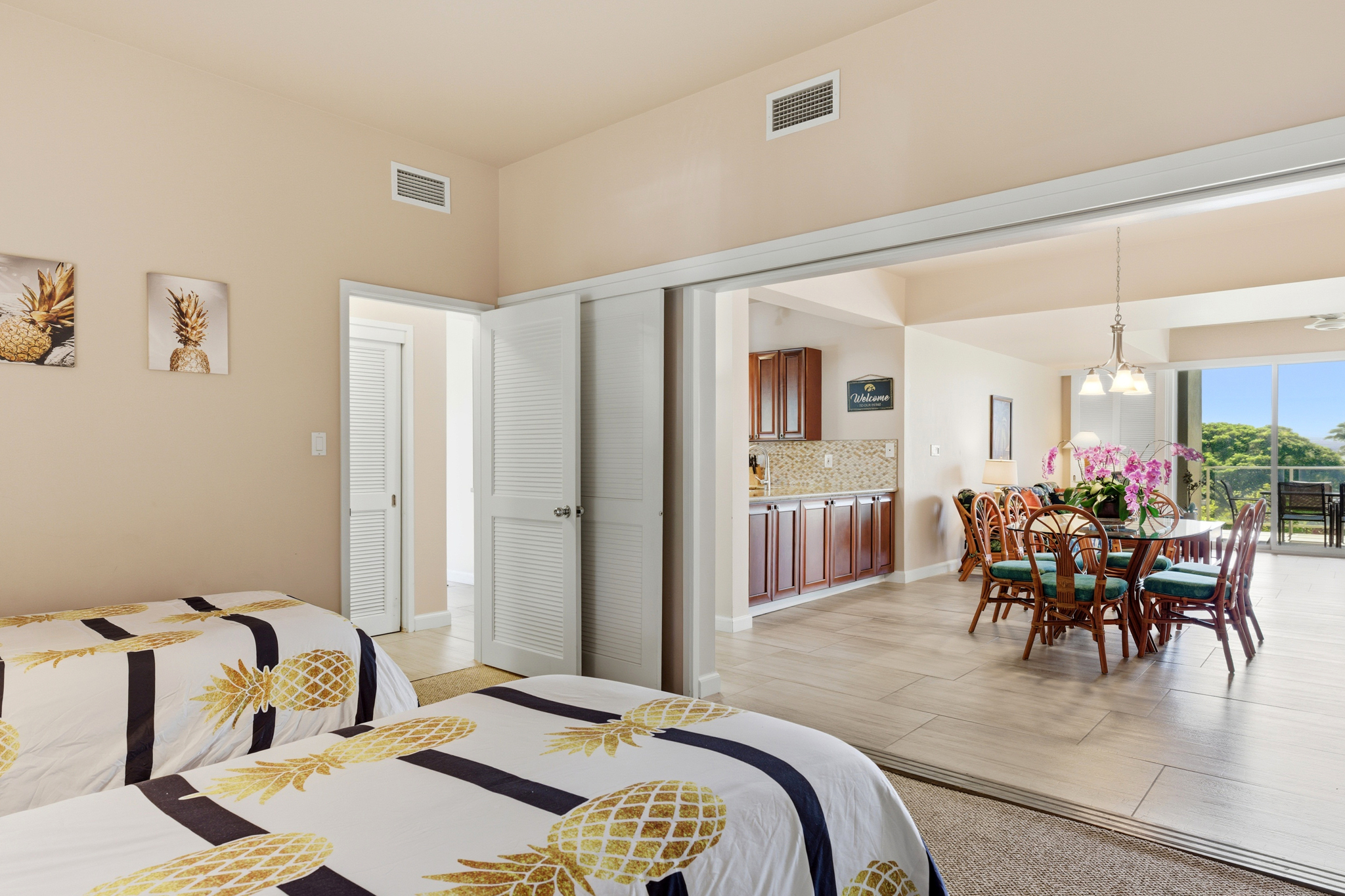 68-1010 Keana Place, Unit E206 Waikoloa, HI 96738 - Photo 15 of 30 a dining room with furniture and wooden floor