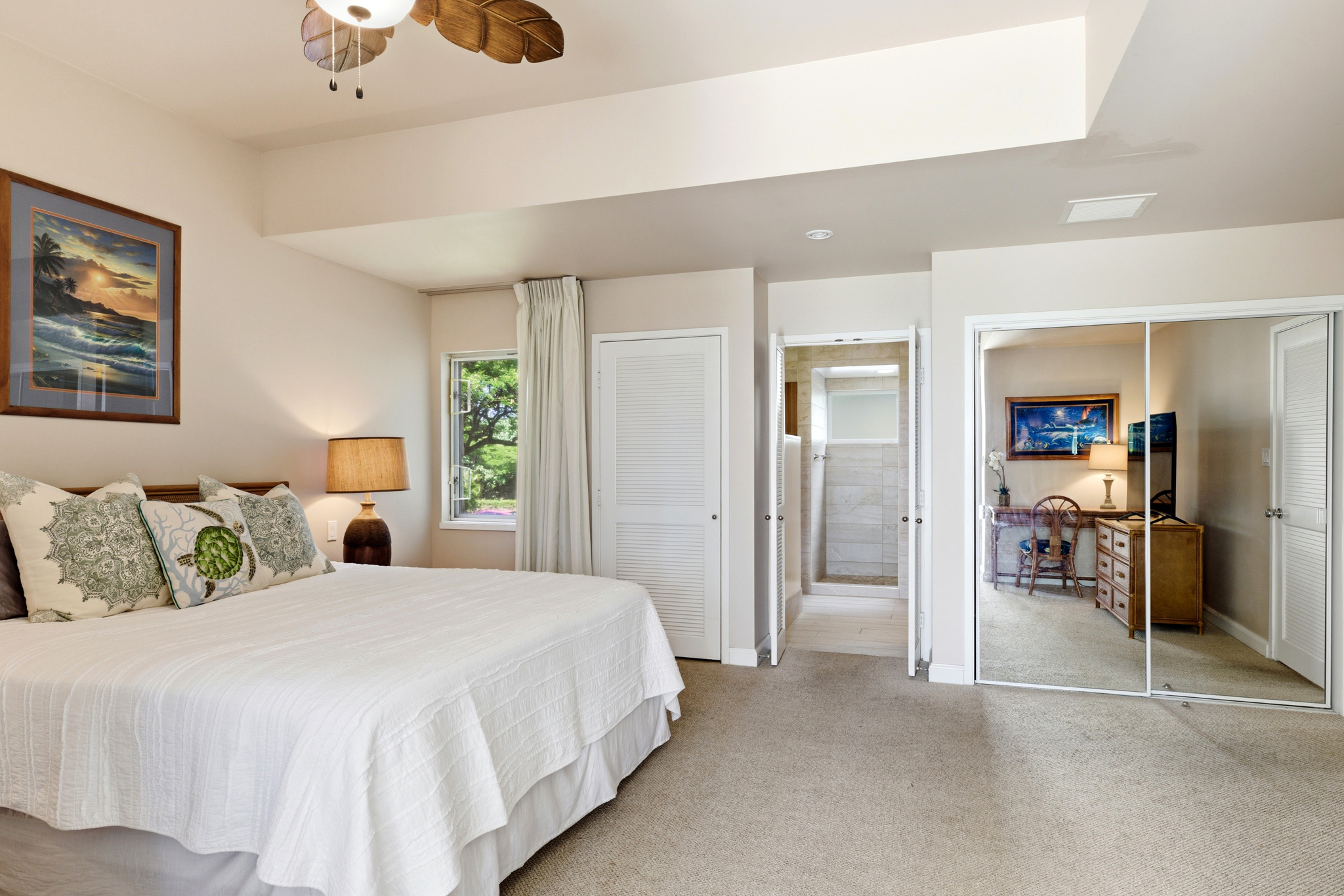 68-1010 Keana Place, Unit E206 Waikoloa, HI 96738 - Photo 21 of 30 a bedroom with a bed and a large mirror