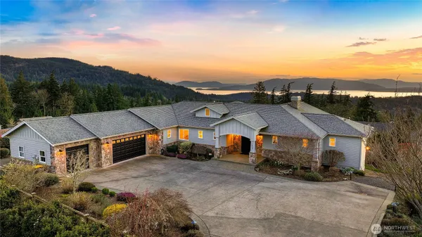 an aerial view of a house with a big yard