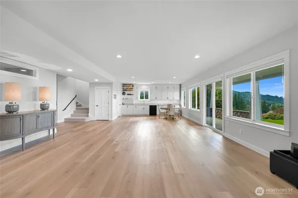 a view of kitchen with furniture and wooden floor