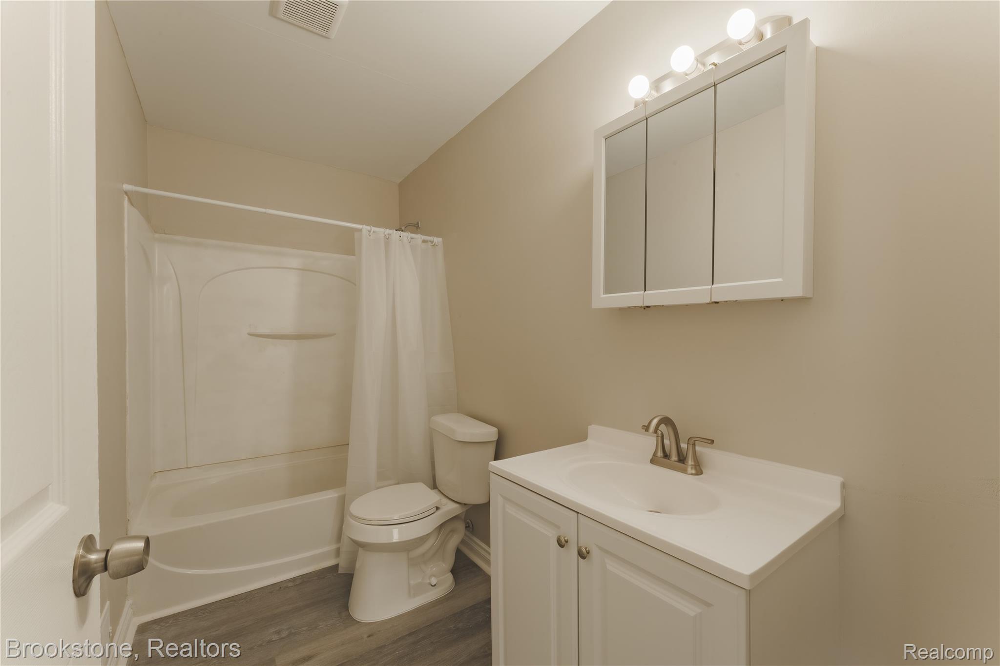 270 Franklin Road Pontiac, MI 48341 - Photo 31 of 46 2nd Floor Full bathroom featuring a single vanity with a white countertop, a tri-fold medicine cabinet, and a shower-tub combination