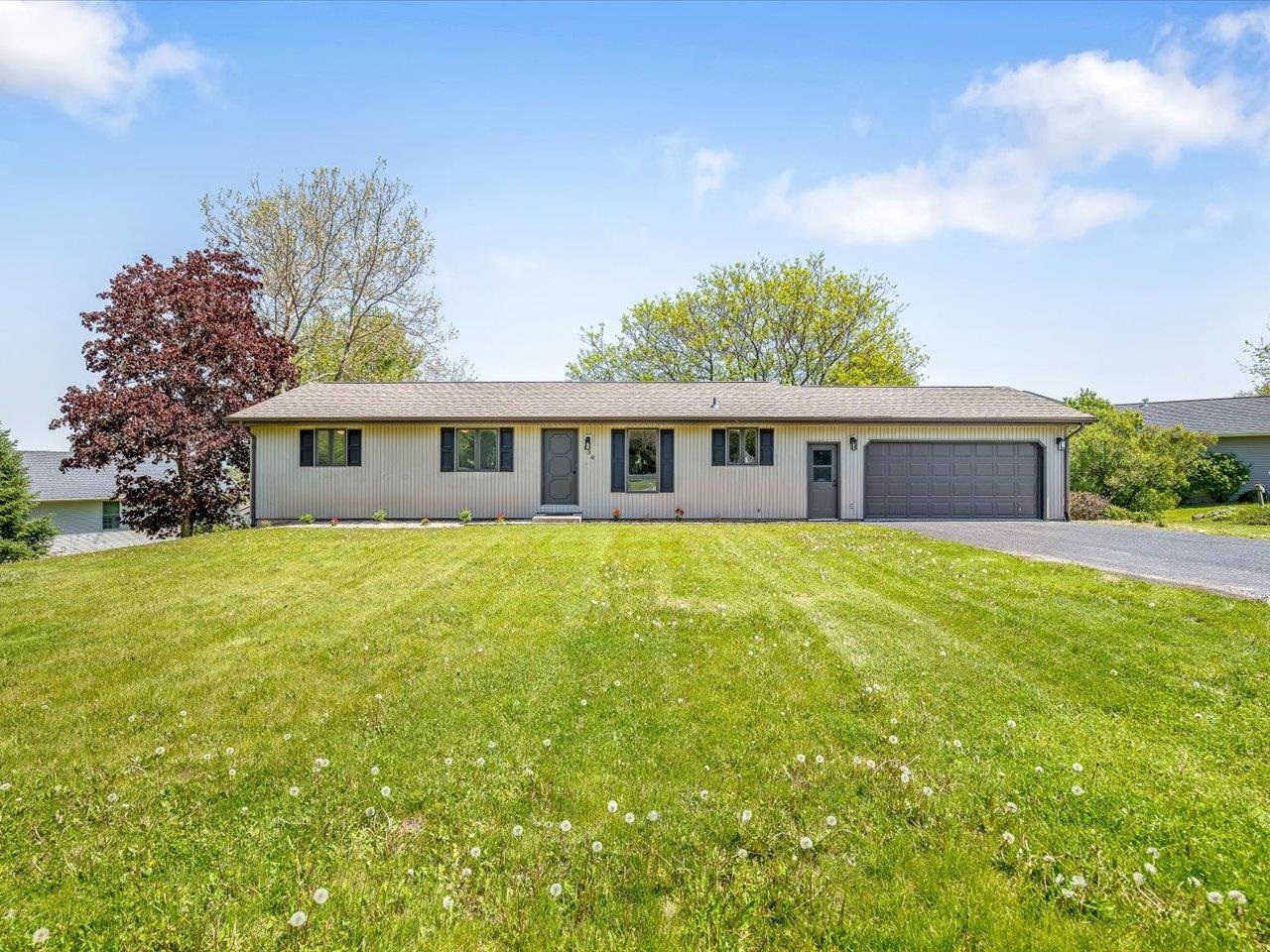 a view of a house with a backyard