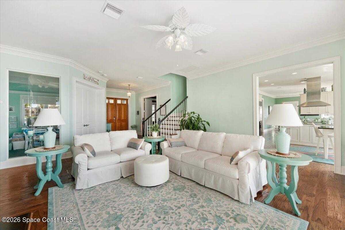 2555 South Tropical Trail Merritt Island, FL 32952 - Photo 12 of 91 a living room with furniture and a large window