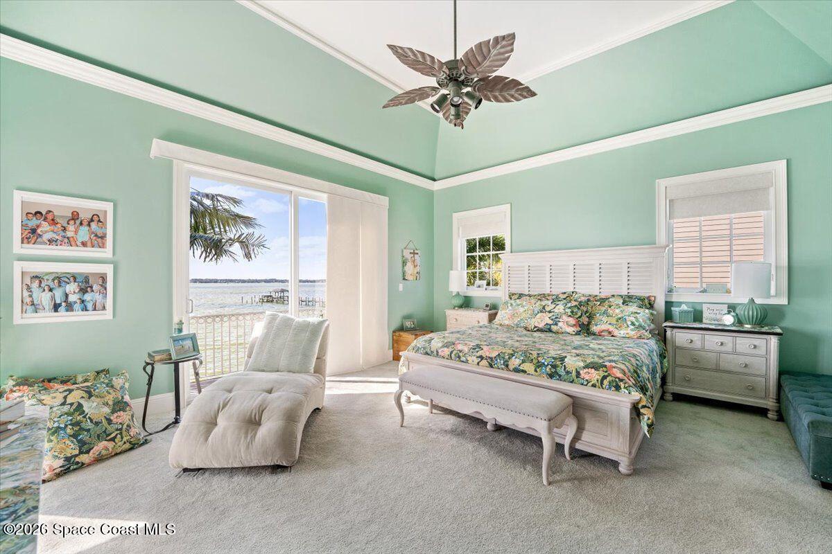 2555 South Tropical Trail Merritt Island, FL 32952 - Photo 14 of 91 a bed room with furniture and a chandelier