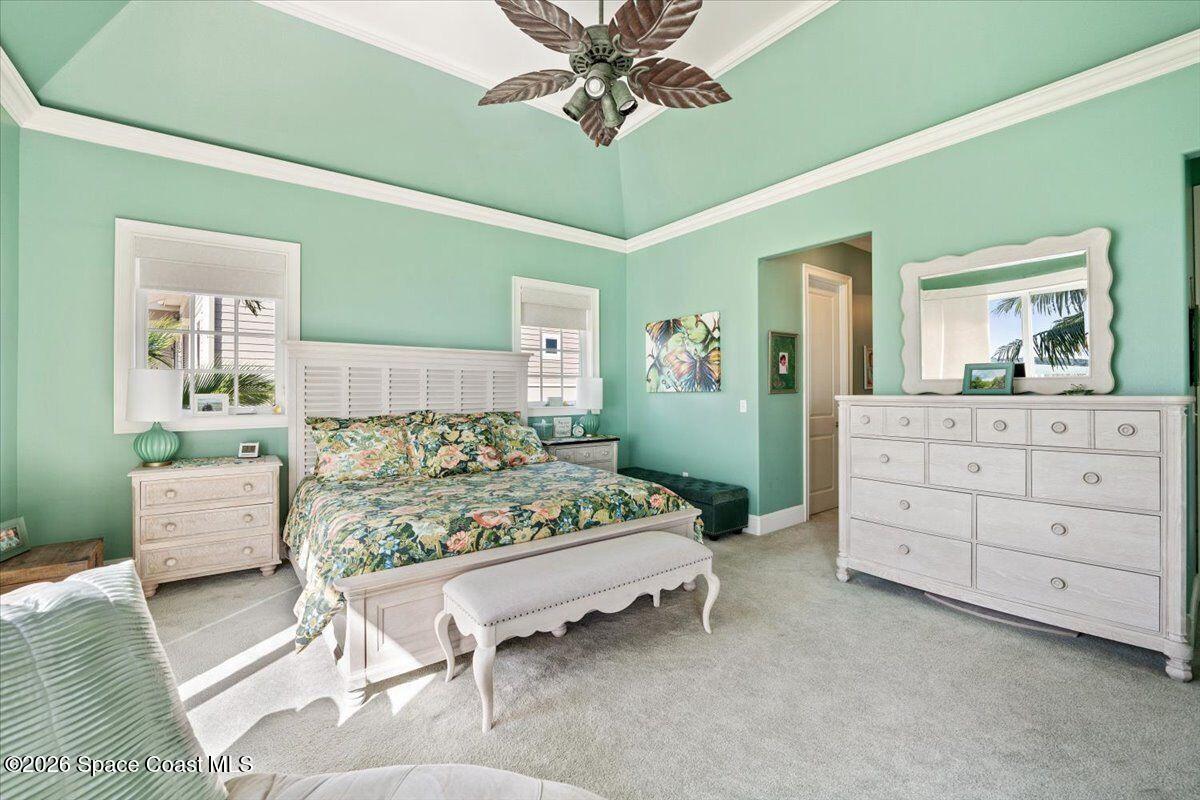 2555 South Tropical Trail Merritt Island, FL 32952 - Photo 21 of 91 a bedroom with a bed and a dresser