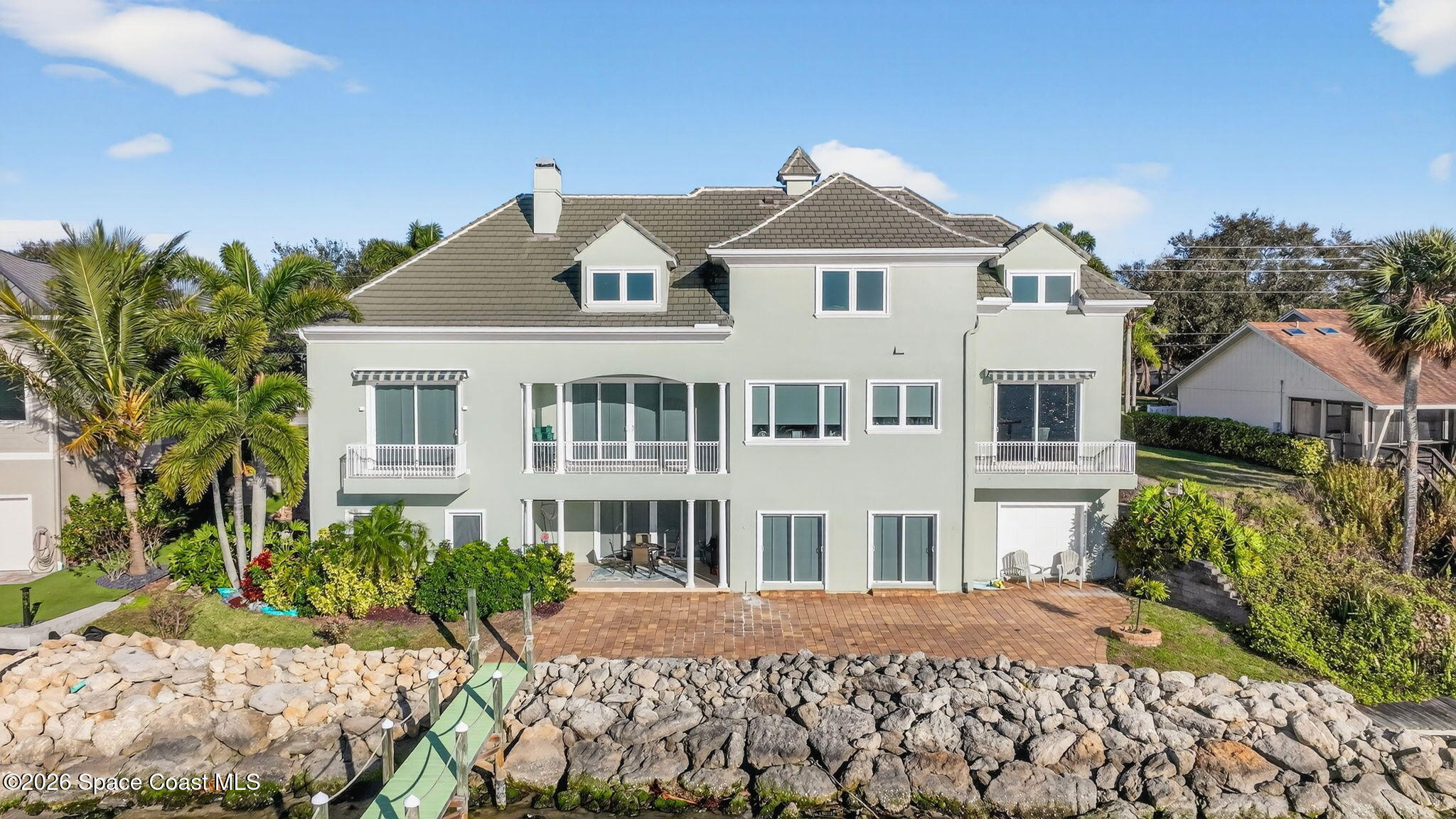 2555 South Tropical Trail Merritt Island, FL 32952 - Photo 3 of 91 a front view of a house with a yard