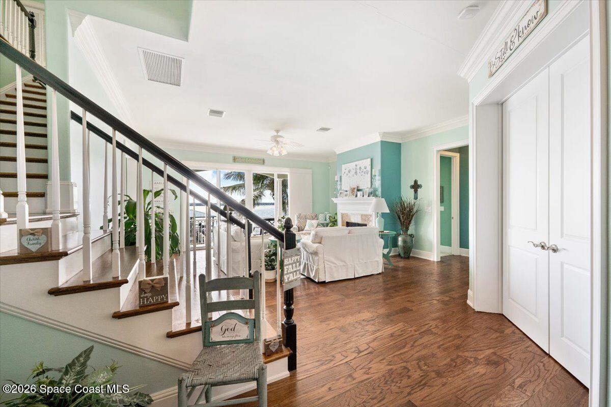 2555 South Tropical Trail Merritt Island, FL 32952 - Photo 33 of 91 a view of entryway livingroom and hall with wooden floor