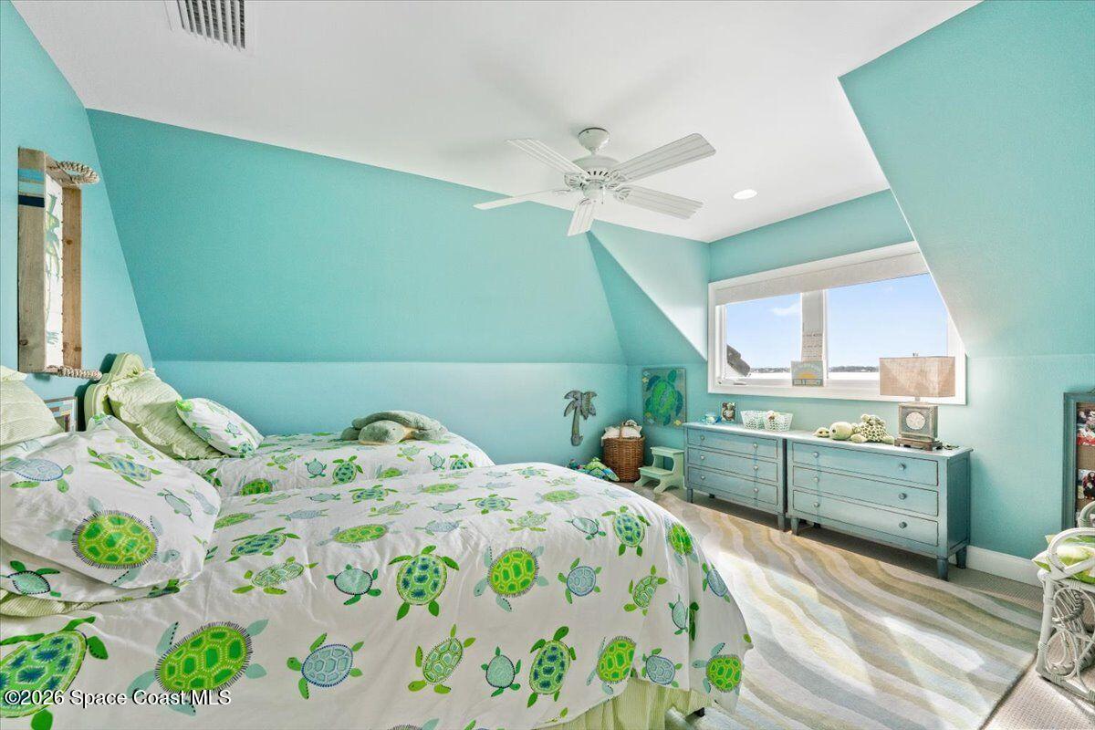 2555 South Tropical Trail Merritt Island, FL 32952 - Photo 42 of 91 a bedroom with a bed and a window