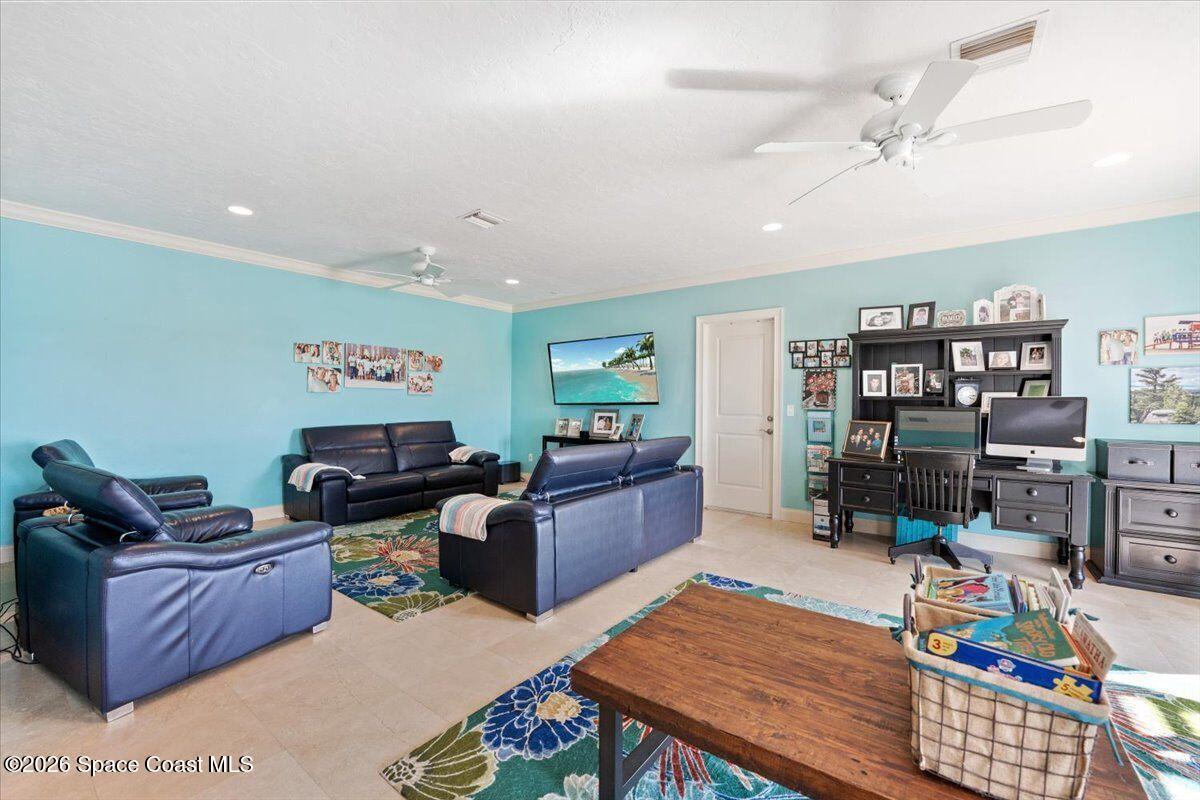 2555 South Tropical Trail Merritt Island, FL 32952 - Photo 46 of 91 a living room with furniture and wooden floor