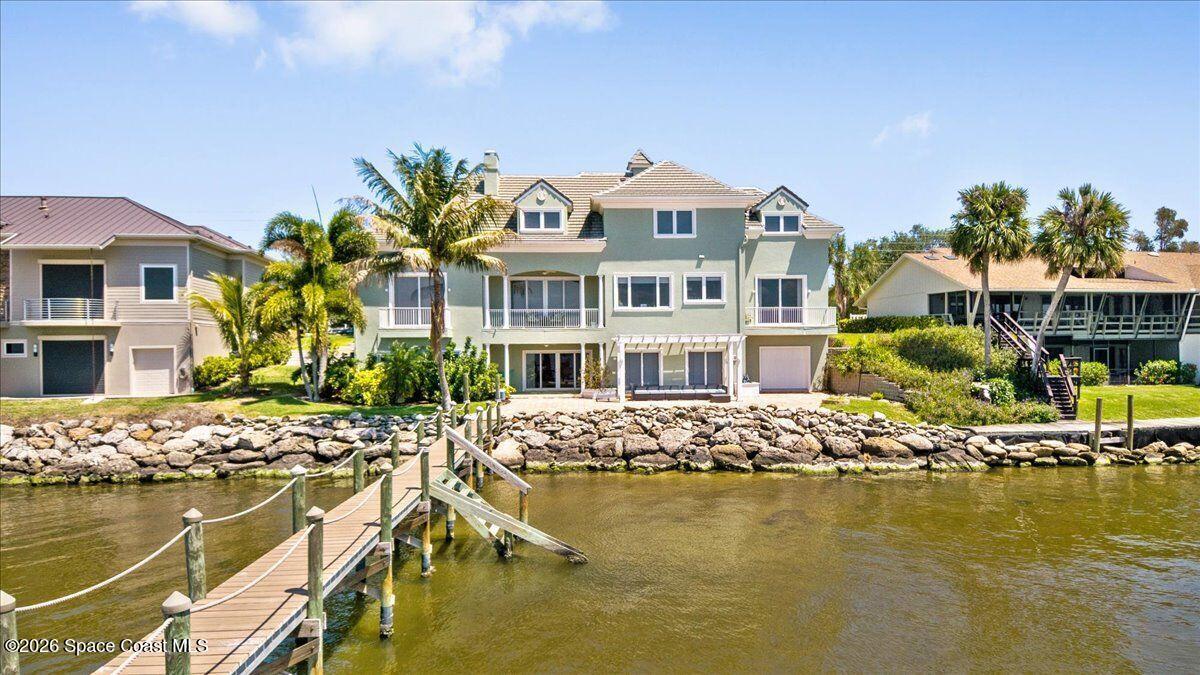 2555 South Tropical Trail Merritt Island, FL 32952 - Photo 75 of 91 a front view of a lake with building
