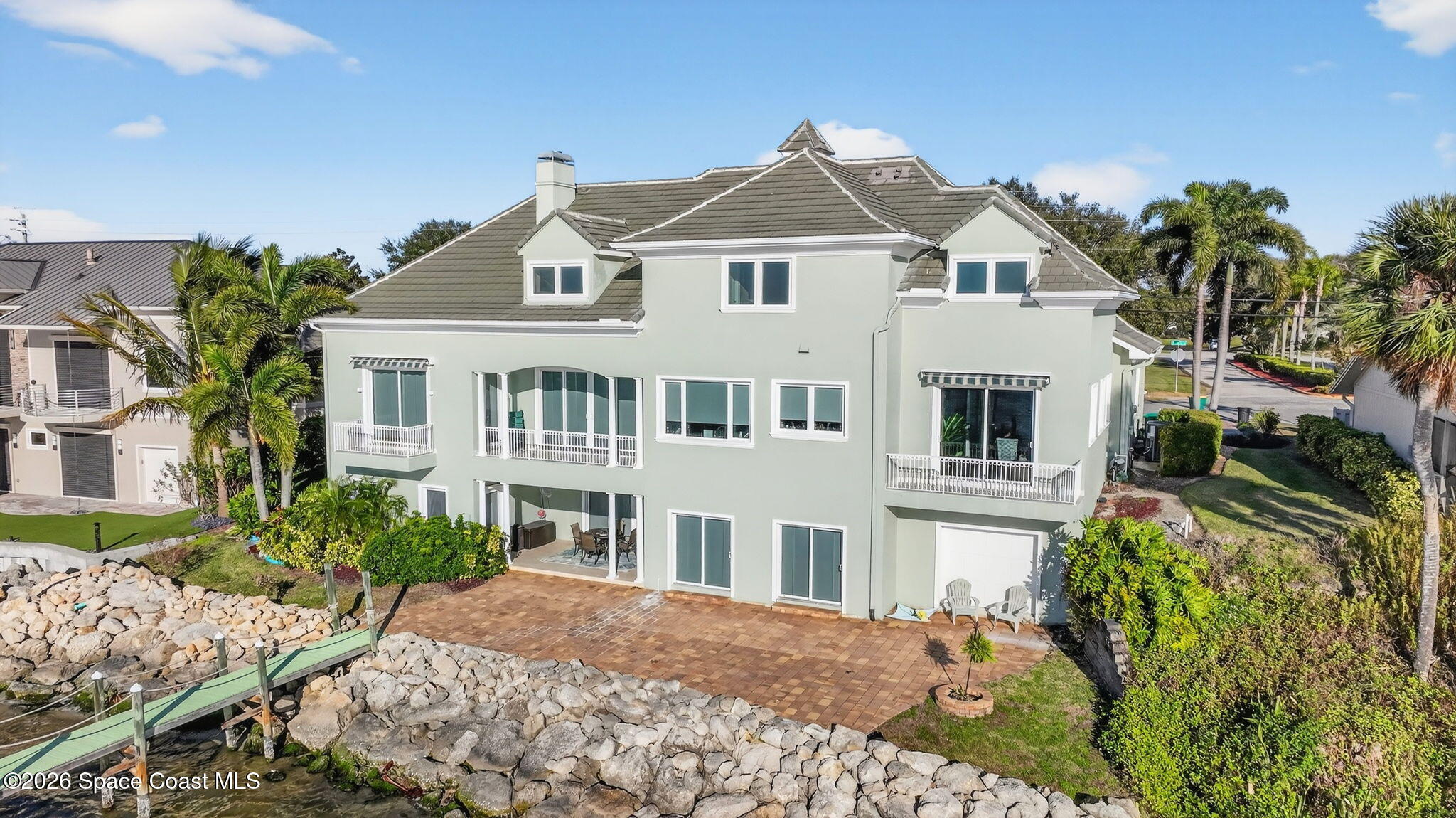 2555 South Tropical Trail Merritt Island, FL 32952 - Photo 77 of 91 a front view of a house with a yard