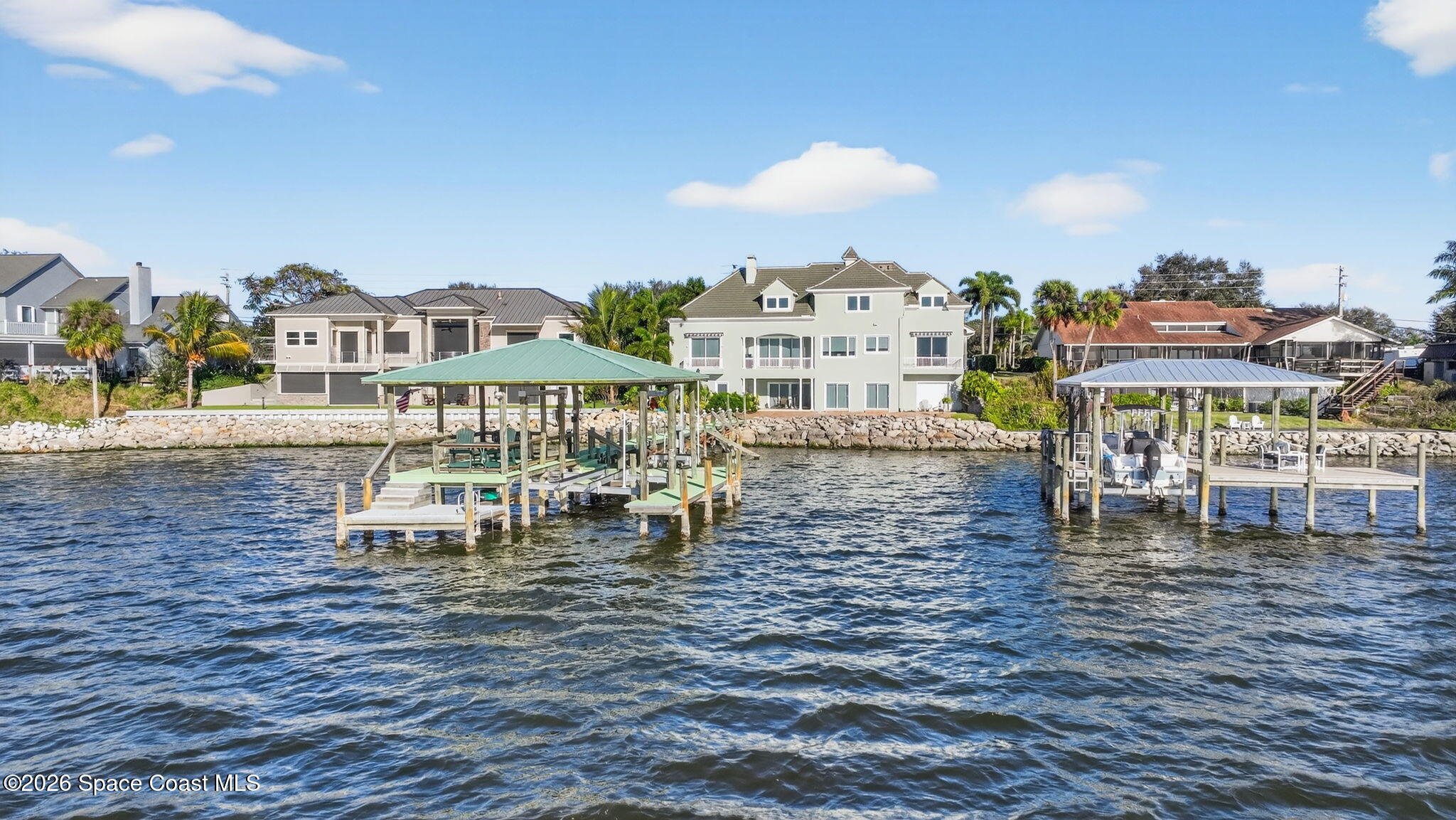 2555 South Tropical Trail Merritt Island, FL 32952 - Photo 84 of 91 a view of a lake with building in front of it