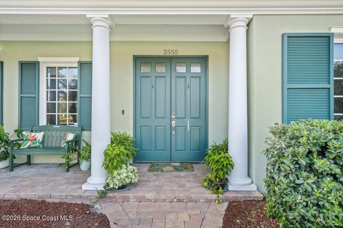 2555 South Tropical Trail Merritt Island, FL 32952 - Photo 9 of 91 a view of a entryway door front of house