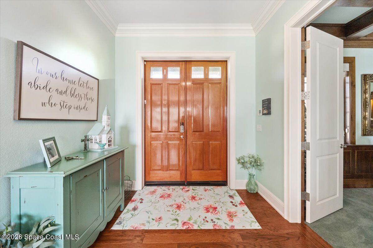 2555 South Tropical Trail Merritt Island, FL 32952 - Photo 10 of 91 a room with painting on the wall and a rug