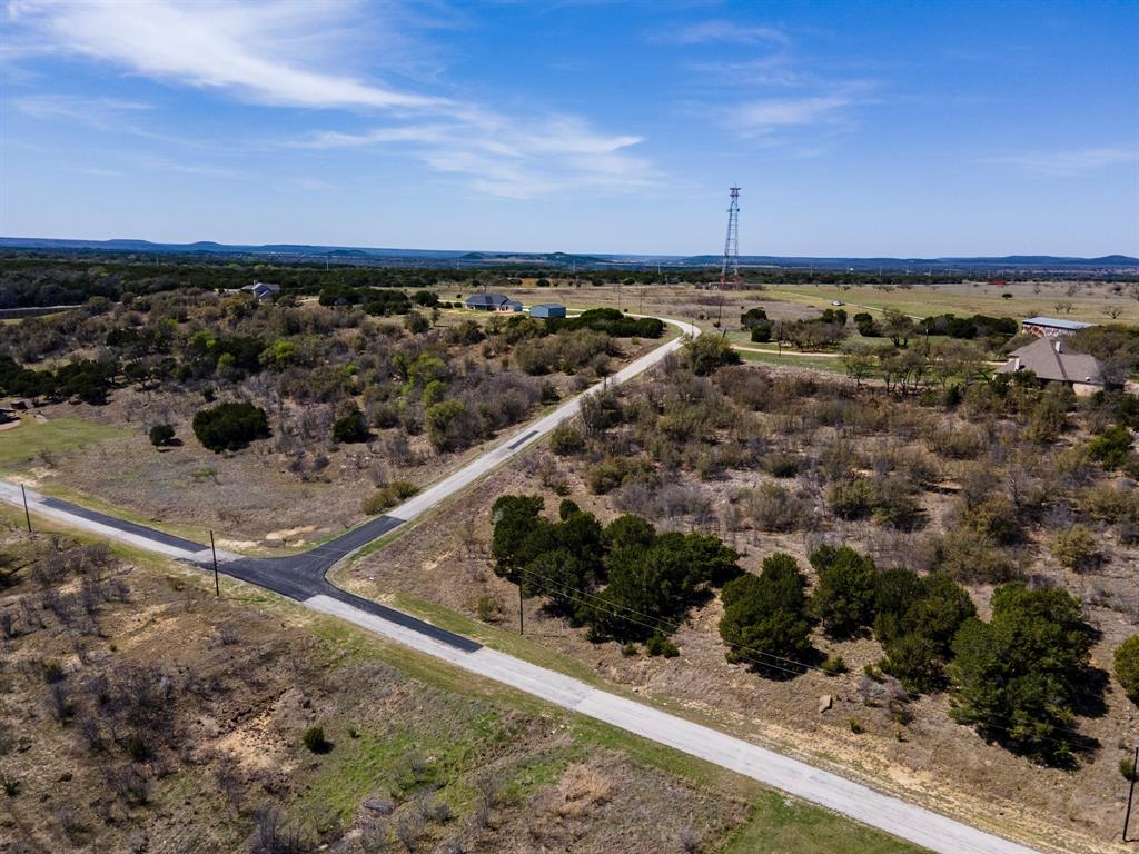 Lot 764 Sawtooth Mountain Road Graford, TX 76449 - Photo 13 of 18 a view of a yard with wooden fence