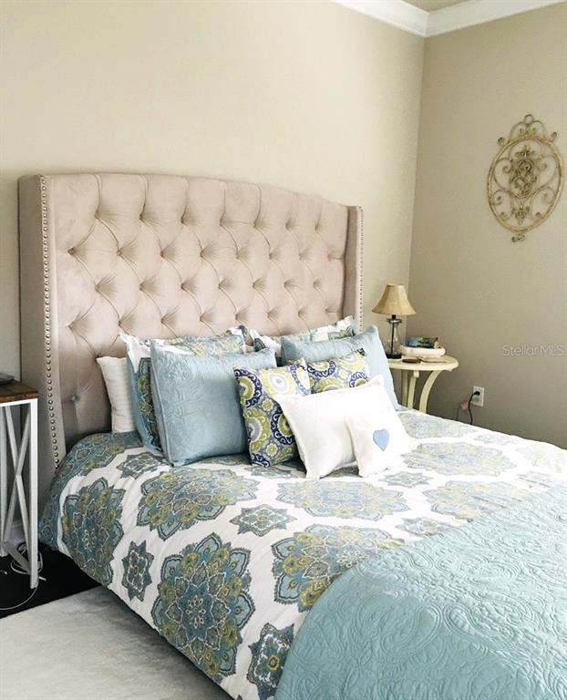 2663 Upper Park Road Orlando, FL 32814 - Photo 11 of 17 a bed sitting in a bedroom and painting on the wall