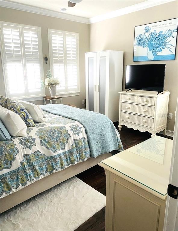 2663 Upper Park Road Orlando, FL 32814 - Photo 12 of 17 a bedroom with a bed and a flat screen tv