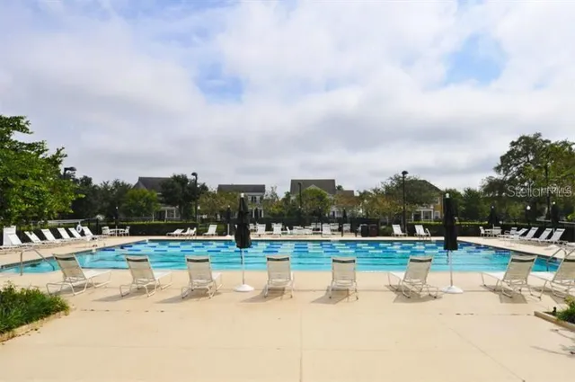 a view of a swimming pool and a yard