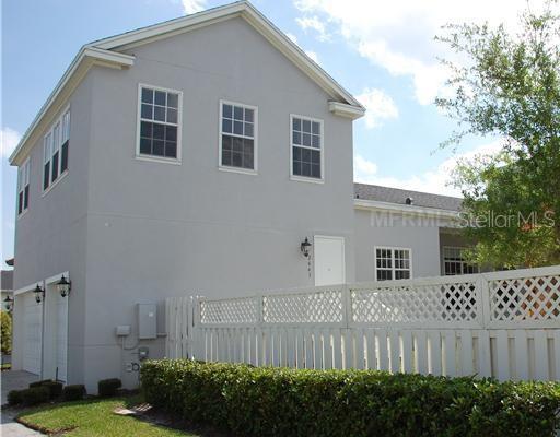2663 Upper Park Road Orlando, FL 32814 - Photo 2 of 17 a front view of a house with a garden