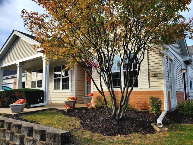 a backyard of a house with seating space
