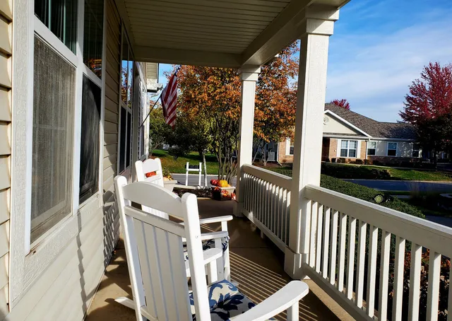 a view of balcony with furniture