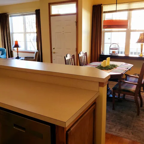a living room with furniture and a floor to ceiling window