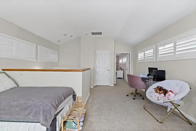 a bedroom with a bed and furniture