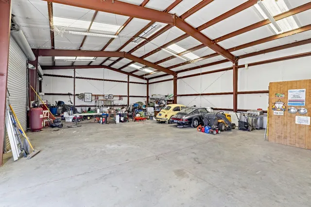 a view of a garage with parked cars