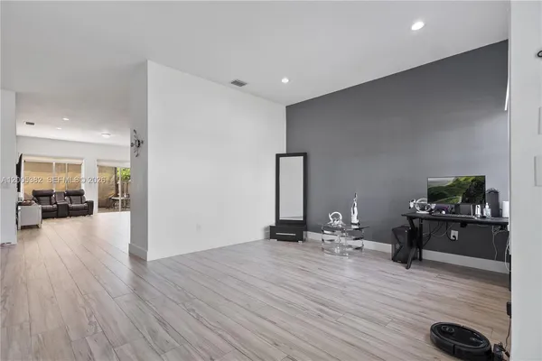 a view of a living room a room with wooden floor