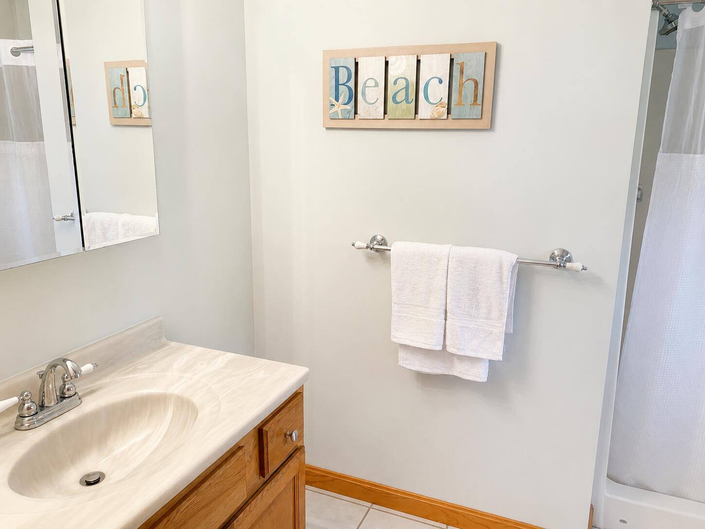 34 10th Street South Edgartown, MA 02539 - Photo 12 of 20 a bathroom with a sink and a mirror