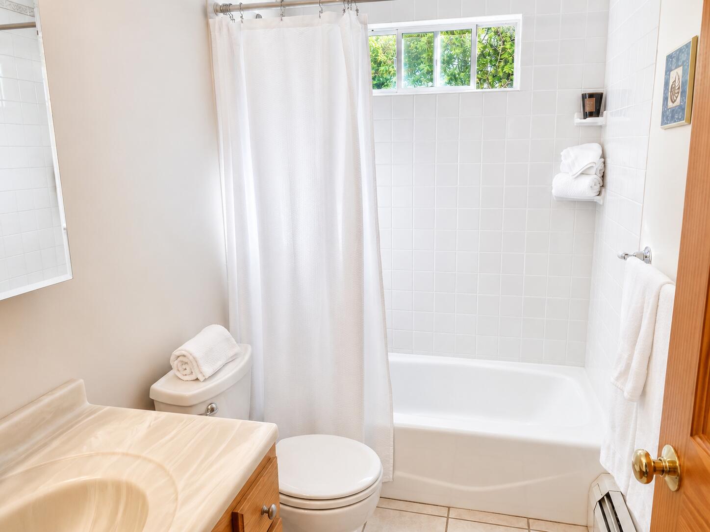 34 10th Street South Edgartown, MA 02539 - Photo 14 of 20 a white toilet sitting next to a bath tub