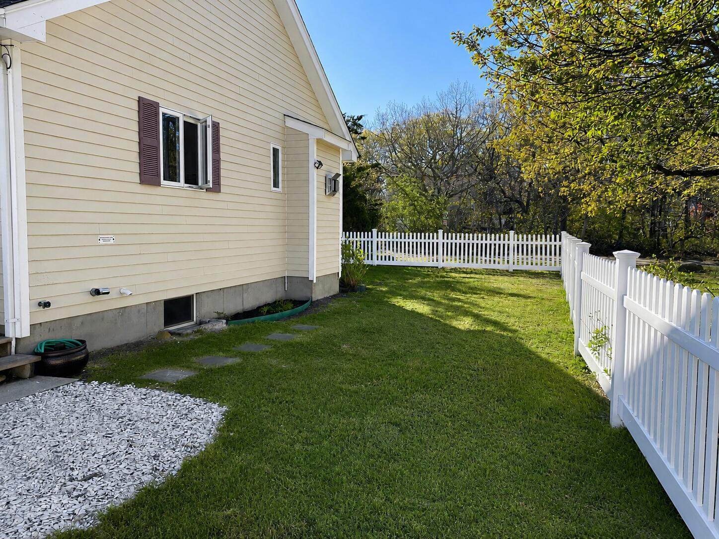 34 10th Street South Edgartown, MA 02539 - Photo 17 of 20 a view of a backyard with a garden