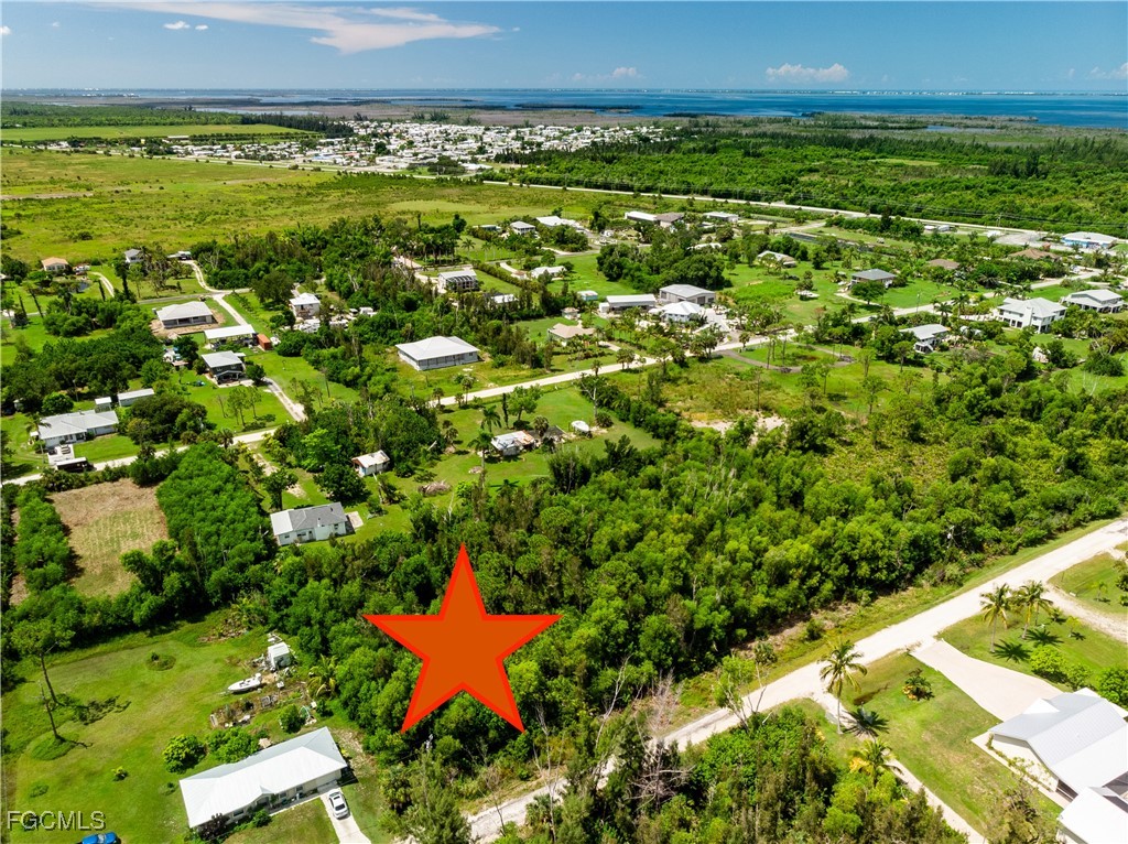 4549 Gulf Shore Road St. James City, FL 33956 - Photo 4 of 7 a view of a large body of water with a building in the background