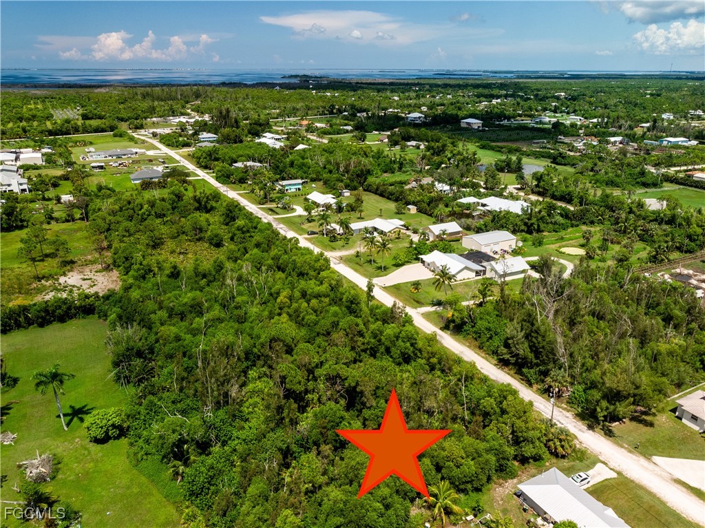 4549 Gulf Shore Road St. James City, FL 33956 - Photo 5 of 7 an aerial view of residential houses with outdoor space and trees