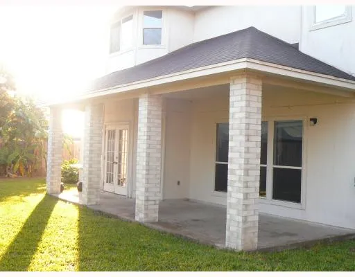 a view of house with yard
