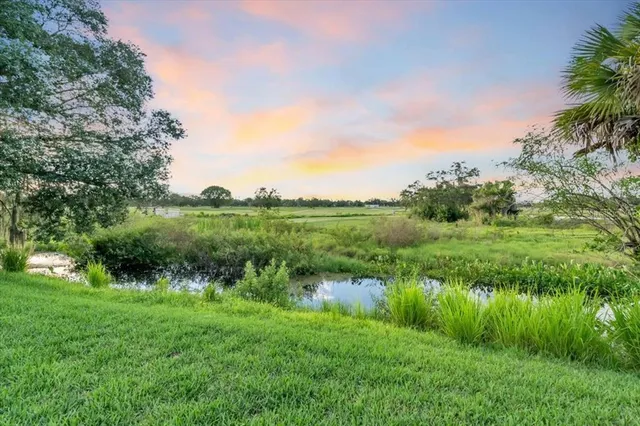 a view of lake with green space
