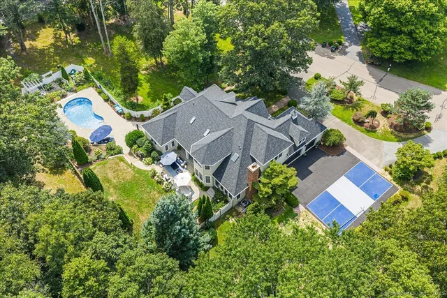 an aerial view of residential house with outdoor space and street view