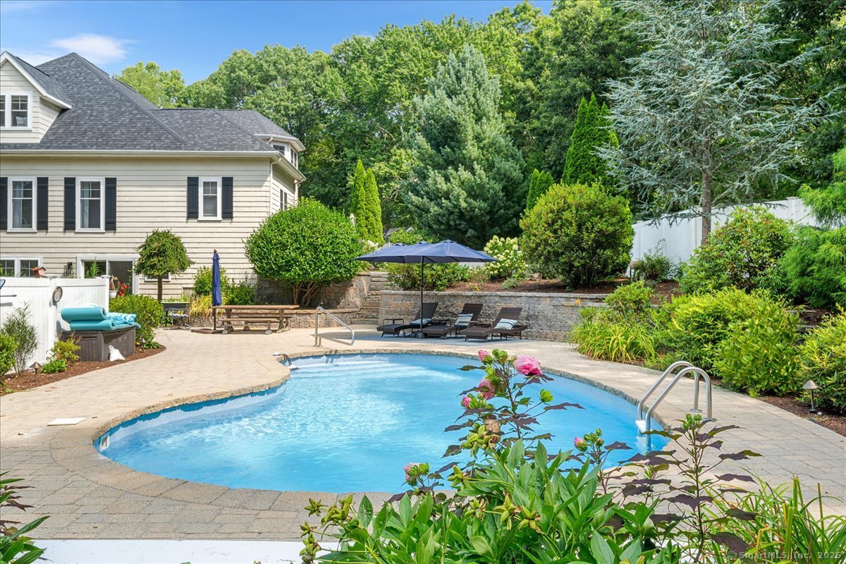 4 Laconia Drive Clinton, CT 06413 - Photo 14 of 40 a view of a backyard with a patio