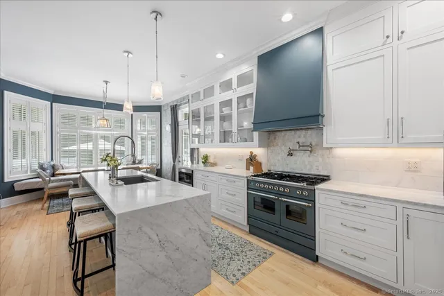 a kitchen with a stove a sink and a refrigerator