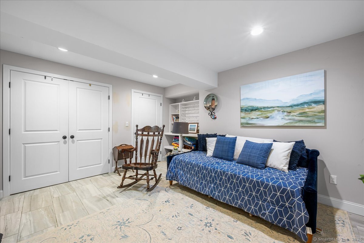 4 Laconia Drive Clinton, CT 06413 - Photo 35 of 40 a bedroom with furniture and a large window