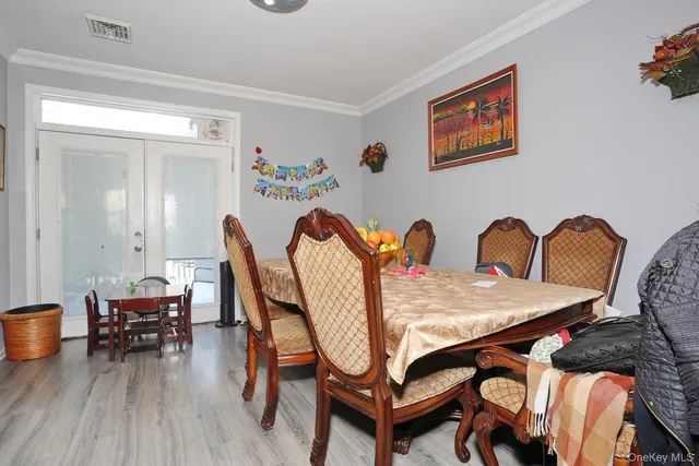 a living room with furniture a clock and a ceiling fan