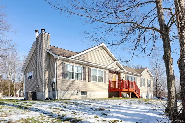 a view of street with house in the background