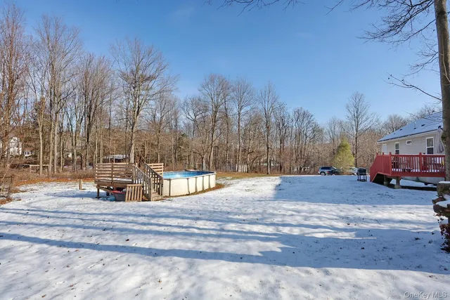 an aerial view of a house with garden space and sitting area